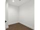 Clean, bright empty room with hardwood floors and white walls at 409 E Oak Ave # 9, Tampa, FL 33602