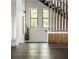 Contemporary staircase with modern wood accents, providing a stylish transition between levels of the home at 409 E Oak Ave # 9, Tampa, FL 33602
