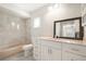 Beautiful bathroom with a soaking tub, vanity with drawers, and tiled walls at 4120 Marine Pkwy, New Port Richey, FL 34652