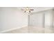 Bedroom features tile floors, ceiling fans, and closet space at 4120 Marine Pkwy, New Port Richey, FL 34652