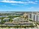 Overhead view capturing this beautiful community with multiple amenities alongside bay views, mature trees, and neighborhood street access at 501 Knights Run Ave # 5101, Tampa, FL 33602