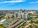 Stunning aerial view of a community, showcasing lush landscaping, nearby waterways, and the vibrant city skyline in the background at 501 Knights Run Ave # 5101, Tampa, FL 33602