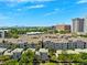 Community aerial perspective, nestled in greenery with nearby buildings and showcasing a serene view of the bay in the background at 501 Knights Run Ave # 5101, Tampa, FL 33602