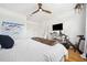 Bedroom featuring hardwood floors, a ceiling fan, and a bed with a faux fur throw at 501 Knights Run Ave # 5101, Tampa, FL 33602