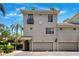 Charming multi-story townhome with attached garages and a well-manicured landscape at 501 Knights Run Ave # 5101, Tampa, FL 33602