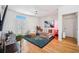 Cozy living room featuring hardwood floors, a ceiling fan, and a french doors at 501 Knights Run Ave # 5101, Tampa, FL 33602