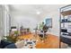 Spacious office with hardwood floors, a ceiling fan, and a large desk and shelving at 501 Knights Run Ave # 5101, Tampa, FL 33602