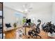 Bright office space with a ceiling fan, hardwood floors, and a standing desk setup near the french doors at 501 Knights Run Ave # 5101, Tampa, FL 33602