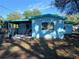 Cozy backyard with covered patio, perfect for outdoor dining and entertaining at 5220 72Nd N St, St Petersburg, FL 33709