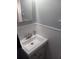 Bathroom features a well lit sink with modern fixtures, beadboard walls and a framed mirror at 5220 72Nd N St, St Petersburg, FL 33709
