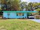 Charming blue single-story home with well-maintained lawn and covered parking at 5220 72Nd N St, St Petersburg, FL 33709