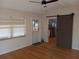 Living room boasts hardwood floors, a barn door, and a window with bright natural light at 5220 72Nd N St, St Petersburg, FL 33709