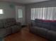 Spacious living room with two couches, hardwood floors, and a bright, airy feel at 5220 72Nd N St, St Petersburg, FL 33709