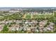 An aerial view capturing the layout of neighborhood homes and nearby community athletic fields at 6556 S West Shore Cir, Tampa, FL 33616