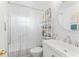 Clean bathroom with white subway tile, new vanity, and decorative shelving at 6556 S West Shore Cir, Tampa, FL 33616