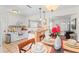 Cozy dining area with hardwood floors and decorative lighting adjacent to the kitchen at 6556 S West Shore Cir, Tampa, FL 33616