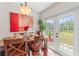 Bright dining area with stylish decor, a view to the yard, and an inviting atmosphere for Gathering meals at 6556 S West Shore Cir, Tampa, FL 33616