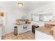 Bright kitchen features white cabinets, stainless appliances, and tiled backsplash at 6556 S West Shore Cir, Tampa, FL 33616