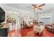 Inviting living room flows into a kitchen and dining area, featuring hardwood floors and ample natural light at 6556 S West Shore Cir, Tampa, FL 33616