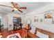 Inviting living room featuring warm hardwood floors, a comfortable couch, and abundant natural light at 6556 S West Shore Cir, Tampa, FL 33616