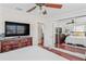 Main bedroom with closet and television at 6556 S West Shore Cir, Tampa, FL 33616