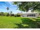 Expansive backyard featuring a well-maintained lawn and ample space for outdoor activities at 719 Straw Lake Dr, Brandon, FL 33510