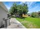 This backyard features a small patio area, providing a great space to unwind and enjoy the outdoors at 719 Straw Lake Dr, Brandon, FL 33510