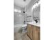 Modern bathroom featuring a marble tiled shower and wood vanity at 719 Straw Lake Dr, Brandon, FL 33510