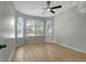 Empty bedroom featuring light walls, ceiling fan and a big window at 719 Straw Lake Dr, Brandon, FL 33510