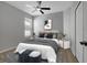 Bedroom featuring a bed, side tables, ceiling fan and a window at 719 Straw Lake Dr, Brandon, FL 33510