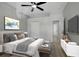 Well staged bedroom featuring a ceiling fan, tv and neutral tones at 719 Straw Lake Dr, Brandon, FL 33510