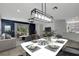 Elegant dining room featuring stylish decor, a modern lighting fixture, and an open layout at 719 Straw Lake Dr, Brandon, FL 33510