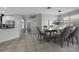 Dining room with a view into the kitchen, and table setting at 719 Straw Lake Dr, Brandon, FL 33510