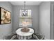 Charming dining area with floral arrangements, a round table and a chandelier at 719 Straw Lake Dr, Brandon, FL 33510