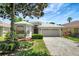 Charming single-Gathering home featuring a well-maintained lawn and mature landscaping at 719 Straw Lake Dr, Brandon, FL 33510