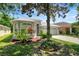 Charming single-Gathering home featuring a well-maintained lawn and mature landscaping at 719 Straw Lake Dr, Brandon, FL 33510