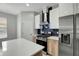 Updated kitchen boasts stainless steel appliances, a center island, and a modern vent hood at 719 Straw Lake Dr, Brandon, FL 33510