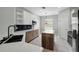 Modern kitchen featuring stainless steel appliances, quartz countertops, an island, and stylish cabinetry at 719 Straw Lake Dr, Brandon, FL 33510