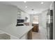 Modern kitchen with quartz countertops, stainless steel appliances, and stylish cabinetry at 719 Straw Lake Dr, Brandon, FL 33510