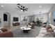 Cozy living space with stylish decor, open to the dining and kitchen areas at 719 Straw Lake Dr, Brandon, FL 33510
