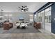 Staged Living Room with tile floor, area rug, furniture, and large windows at 719 Straw Lake Dr, Brandon, FL 33510