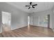 Spacious main bedroom features an ensuite bath, private outdoor access, wood floors, and a trey ceiling at 719 Straw Lake Dr, Brandon, FL 33510
