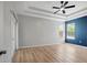 Large main bedroom showcasing a tray ceiling, ceiling fan, and wood floors at 719 Straw Lake Dr, Brandon, FL 33510