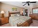 Comfortable bedroom with stylish furnishings, ceiling fan, and serene decor at 7657 Caponata Blvd, Seminole, FL 33777