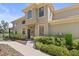 Charming two-story home with lush landscaping, a welcoming entryway, and well-maintained exterior at 7657 Caponata Blvd, Seminole, FL 33777