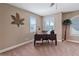 Cozy home office featuring plantation shutters, a classic desk, and tranquil decor at 7657 Caponata Blvd, Seminole, FL 33777