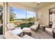 Inviting screened lanai with comfortable seating, offering scenic water views and relaxing outdoor living at 7657 Caponata Blvd, Seminole, FL 33777
