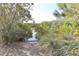 Scenic waterfront view showcasing tranquil waters surrounded by lush vegetation at 7657 Caponata Blvd, Seminole, FL 33777