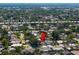Aerial view of residential neighborhood close to Pinellas Trail, mature trees, and diverse architecture at 8763 Matthew St, Seminole, FL 33772