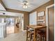 Cozy breakfast nook with table and seating, situated adjacent to the kitchen and overlooking the patio at 8763 Matthew St, Seminole, FL 33772